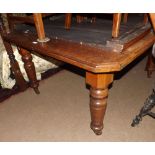 Victorian Walnut extending Dining Table of octagonal form, complete with two extra leaves, raised on
