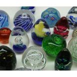 Mixed lot various assorted 20th Century coloured glass paperweights decorated in various geometric