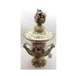 A large 19th Century Coalport Urn formed Vase, decorated with floral encrusted lid finial, the