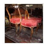 Set of six Victorian balloon back Dining Chairs, with red upholstered seats and front cabriole legs,