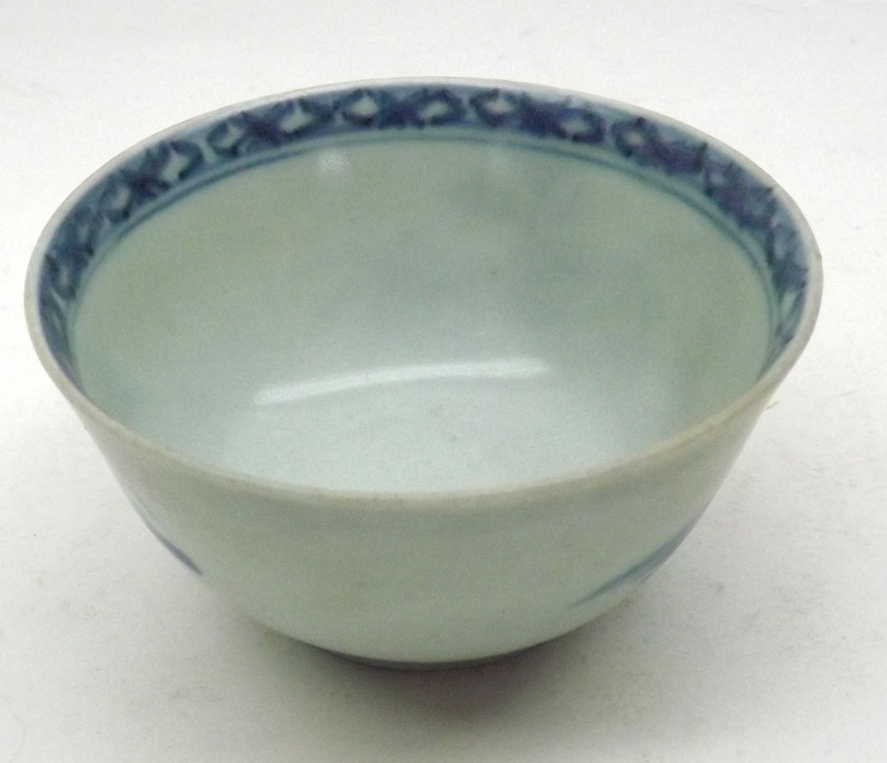 A Nankin Cargo Tea Bowl and Saucer, typically decorated in underglaze blue with Chinese river scene, - Image 6 of 7