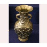 A Chinese Gilded Bronze Large Baluster Vase of two-handled tapering ovoid form, embossed with