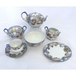 An Oriental Eggshell Tea Service, the borders all painted in iron red, underglaze blue etc with