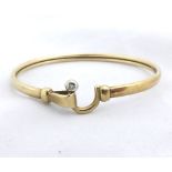 Hallmarked 9ct Gold sprung bangle with small Diamond inset to the catch, weighing approximately 8gms