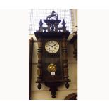 20th Century Walnut cased Vienna type Wall Clock, the overhanging cornice surmounted by a pierced