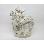 A 19th Century Staffordshire Model of a figure on horseback, raised on a plinth base, decorated