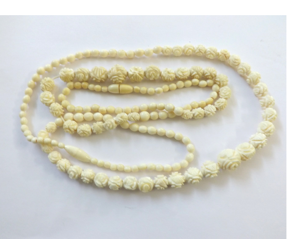 Two early 20th Century Carved Ivory Bead Necklaces, 48cm and 56cm long (2)