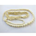 Two early 20th Century Carved Ivory Bead Necklaces, 48cm and 56cm long (2)