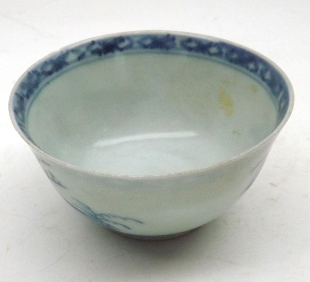 A Nankin Cargo Tea Bowl and Saucer, typically decorated in underglaze blue with Chinese river scene, - Image 5 of 7