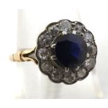 Yellow metal centre dark blue Sapphire and twelve old cut Diamond surround Cluster Ring, unmarked