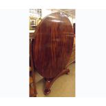 A large 19th Century Mahogany Pedestal Dining Table, the round flip top raised on a spreading