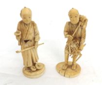 A pair of Carved Ivory Models of workmen, each clutching implements in their hands of sectional