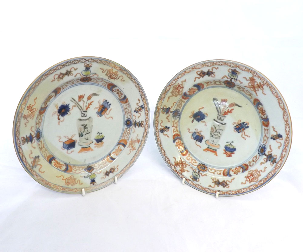 A pair of 18th Century Chinese Plates, of circular form, painted predominantly in iron red and