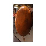 Victorian Burr Walnut veneered oval Loo Table, the top raised on an elaborate quatre base, with