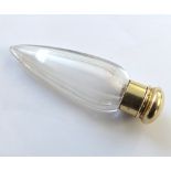An early 20th Century Facetted Clear Glass Scent Bottle, icicle shaped with hinged yellow metal lid,