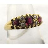 An 18ct Gold three Ruby and four Brilliant Cut Diamond Ring, hallmarked for Birmingham 1900