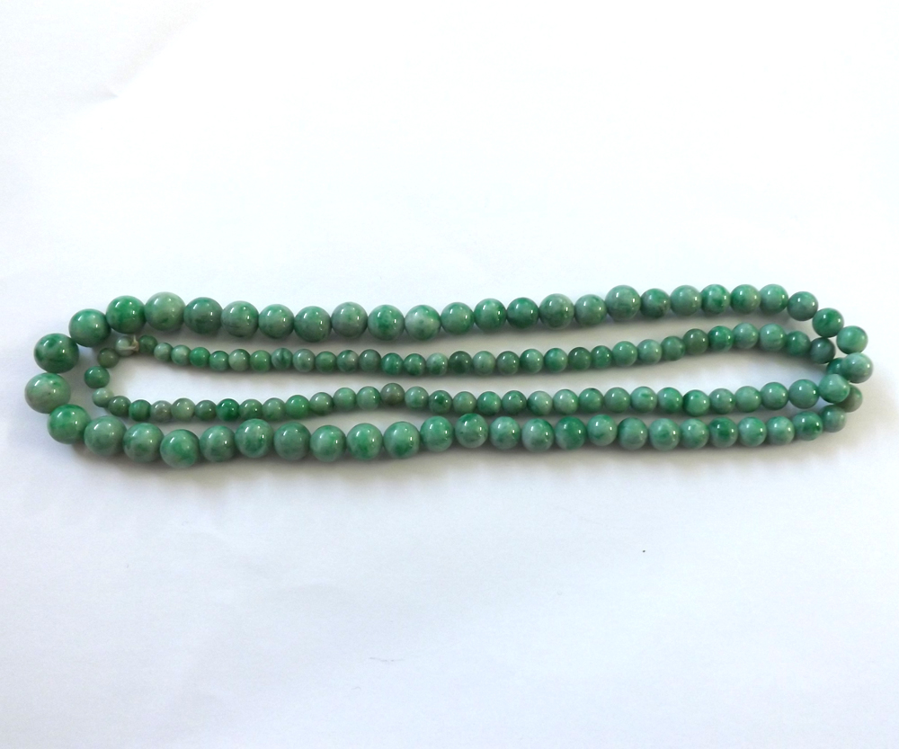 A string of Graduated Polished Jade Beads, 74cm long, the largest bead approx 9mm diameter - Image 2 of 2