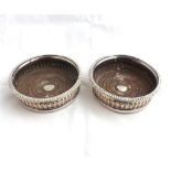 Pair of 19th Century Silver plate on Copper round Decanter or Bottle Stands, with wooden bases, 5 =