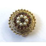 A 20th Century Circular yellow metal Brooch, with two filigree outers, the centre panel set with