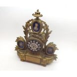 Late 19th Century gilt Spelter and porcelain mounted Mantel Clock, the drum shaped case surmounted