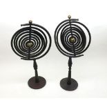 Pair of vintage Cast Iron Planetary Orbit Stands formed as concentric circles, raised on pedestal