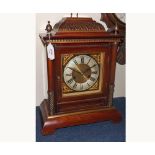 Early 20th Century Brass mounted Walnut Mantel Clock, the case with overhanging cornice surmounted