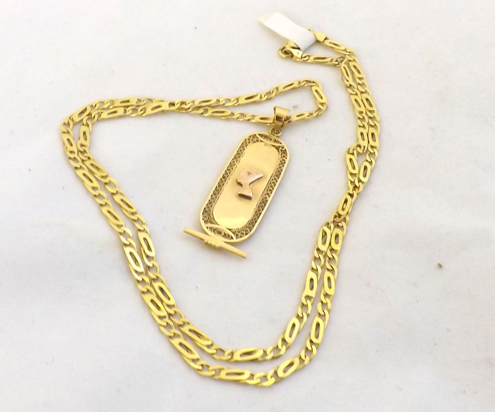 Egyptian high grade Yellow Metal Pendant, oval shaped with raised female head to the centre,