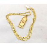 Egyptian high grade Yellow Metal Pendant, oval shaped with raised female head to the centre,