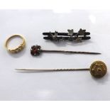 A Mixed Lot containing: a Victorian Stick Pin with large Gold finial with raised centre featuring