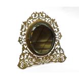 An unusual 19th Century Brass framed easel backed Dressing Table Mirror with pierced foliate frame