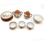 An Oriental Eggshell Tea Service, decorated in the Kutani manner in typical colours and comprising