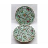 Two Oriental Celadon Plates, typically decorated in famille rose and verte etc with exotic birds,