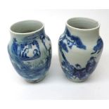 Pair of 19th Century Chinese Baluster Vases, painted in underglaze blue with scenes of figures in