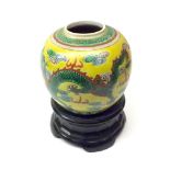 Oriental Ginger Jar decorated in famille vert with dragons on a lemon ground (lid missing)