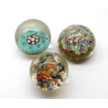 Collection of three various paperweights, two of Millefiori design, one of scrambled form, the other