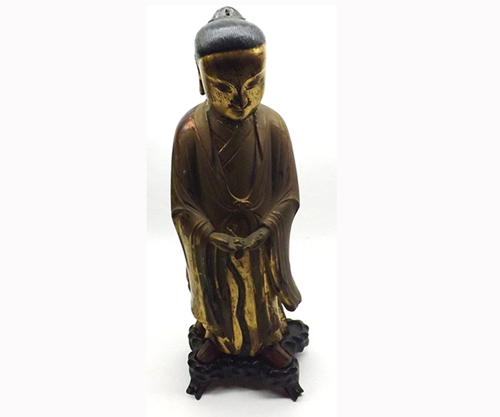 Large Chinese or Tibetan gilt painted treen figure of priest wearing ceremonial robes, further red
