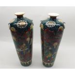 Pair of Chinese vases of tapering circular form, the rims applied with ring handles, the body