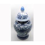 Large Oriental covered Baluster Vase, decorated throughout in underglaze blue with stylised