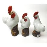 A collection of three Oriental models of Chickens, all decorated in white with naturalistic faces,