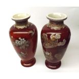 Pair of late Satsuma Baluster Vases, decorated with flowering trees on iron red ground, 20th