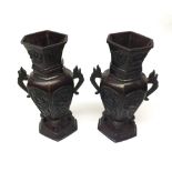 Pair of Chinese Bronze Baluster Vases of hexagonal form, applied with angled handles and the