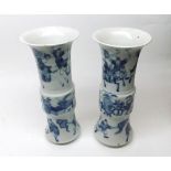 Pair of Chinese Trumpet Vases of circular Baluster form painted in underglaze blue with Warriors and
