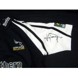 Packet containing Newcastle Falcons replica Rugby shirt signed by Johnny Wilkinson to the sleeve