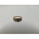 Edwardian hallmarked 9ct Gold Ring, the curved front set with five small dark blue Sapphires and a
