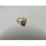 Unmarked yellow metal Ring, claw set with a single Pearl