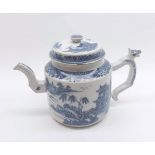 A Nankin Teapot of cylindrical form, typically decorated in underglaze blue with a Chinese river