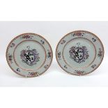 A pair of 18th Century Chinese Armorial Plates, the centres painted in colours with heraldic