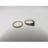 Hallmarked 22ct Gold Wedding Ring weighing 1 1/2 gms together with a Bravingtons 18ct Gold and