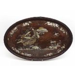 An Oriental Hardwood Oval Tray decorated in the Shibayama manner with exotic birds and foliage, (rim