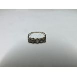 Hallmarked 18ct Gold five old cut Diamond Ring of approximately .8ct total (carved setting)